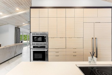 Welcome to this stunning, fully renovated contemporary residence on Bocaire Country Club in Florida - for sale on GolfHomes.com, golf home, golf lot