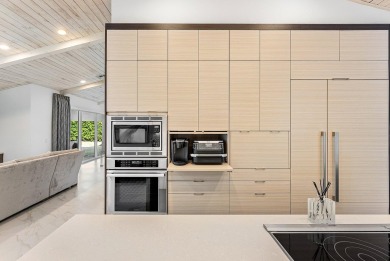 Welcome to this stunning, fully renovated contemporary residence on Bocaire Country Club in Florida - for sale on GolfHomes.com, golf home, golf lot