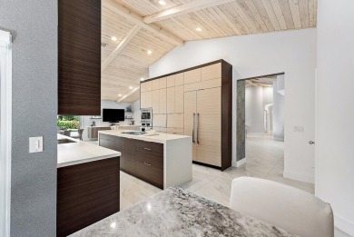 Welcome to this stunning, fully renovated contemporary residence on Bocaire Country Club in Florida - for sale on GolfHomes.com, golf home, golf lot