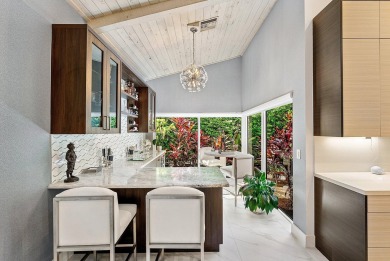 Welcome to this stunning, fully renovated contemporary residence on Bocaire Country Club in Florida - for sale on GolfHomes.com, golf home, golf lot