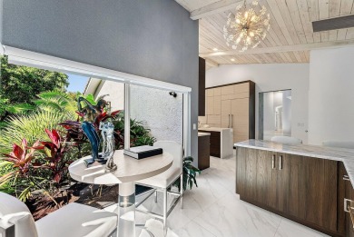 Welcome to this stunning, fully renovated contemporary residence on Bocaire Country Club in Florida - for sale on GolfHomes.com, golf home, golf lot