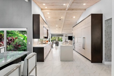 Welcome to this stunning, fully renovated contemporary residence on Bocaire Country Club in Florida - for sale on GolfHomes.com, golf home, golf lot