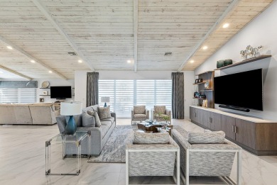 Welcome to this stunning, fully renovated contemporary residence on Bocaire Country Club in Florida - for sale on GolfHomes.com, golf home, golf lot