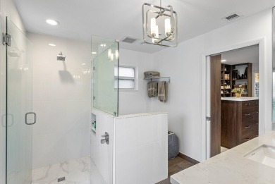 Welcome to this stunning, fully renovated contemporary residence on Bocaire Country Club in Florida - for sale on GolfHomes.com, golf home, golf lot