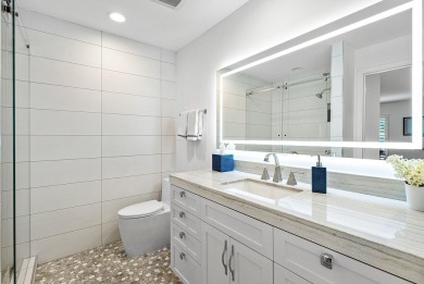 Welcome to this stunning, fully renovated contemporary residence on Bocaire Country Club in Florida - for sale on GolfHomes.com, golf home, golf lot