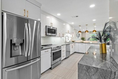 This lavishly remodeled Westgate townhouse boasts two bedrooms on Delray Dunes Golf and Country Club in Florida - for sale on GolfHomes.com, golf home, golf lot