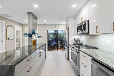 This lavishly remodeled Westgate townhouse boasts two bedrooms on Delray Dunes Golf and Country Club in Florida - for sale on GolfHomes.com, golf home, golf lot