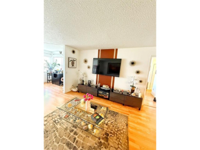 Charming Corner Garden-Style Condo Located on the first floor in on Sunrise Lakes Phase III in Florida - for sale on GolfHomes.com, golf home, golf lot