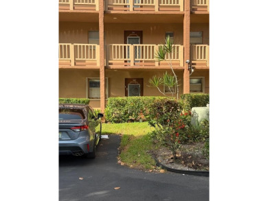 Charming Corner Garden-Style Condo Located on the first floor in on Sunrise Lakes Phase III in Florida - for sale on GolfHomes.com, golf home, golf lot