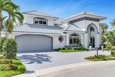 PRIMARY BEDROOM IS UPSTAIRS! Experience luxurious living in this on Broken Sound Golf and Club  in Florida - for sale on GolfHomes.com, golf home, golf lot