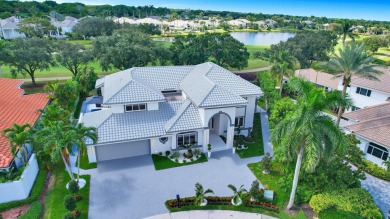 PRIMARY BEDROOM IS UPSTAIRS! Experience luxurious living in this on Broken Sound Golf and Club  in Florida - for sale on GolfHomes.com, golf home, golf lot