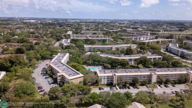 Stunning 2/2 Corner Unit in Wynmoor's Premier 55+ Community on Wynmoor Golf Course in Florida - for sale on GolfHomes.com, golf home, golf lot