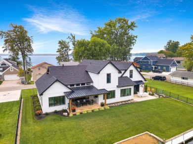 Gorgeous Custom-Built Home on Lake Wawasee Channel - Turnkey on Wawasee Golf Club in Indiana - for sale on GolfHomes.com, golf home, golf lot