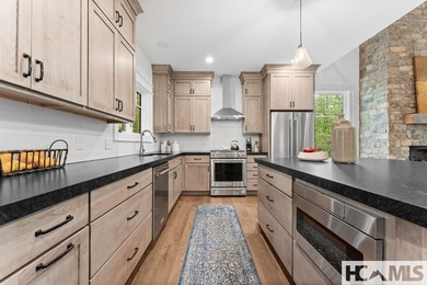 Nestled within the private, gated confines of Chinquapin, a 2 on Natures Walk At Chinquapin in North Carolina - for sale on GolfHomes.com, golf home, golf lot