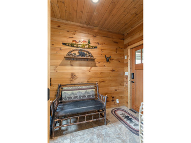 Step inside and feel the warmth of this beautifully crafted on Sapphire National Golf Club in North Carolina - for sale on GolfHomes.com, golf home, golf lot