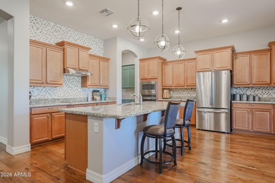 This exceptional energy-efficient 4-bedroom, 3.5-bath home with on Estrella Mountain Ranch Golf Course in Arizona - for sale on GolfHomes.com, golf home, golf lot