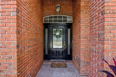 Stunning JA Long custom, all-brick home situated on the 17th on Eagle Harbor Golf Club in Florida - for sale on GolfHomes.com, golf home, golf lot