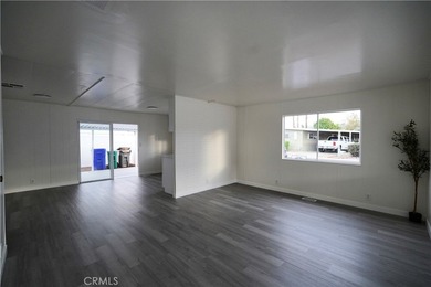 Step into this sun-filled 2 bedroom, 2 bath retreat where modern on Date Palm Country Club in California - for sale on GolfHomes.com, golf home, golf lot