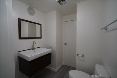 Step into this sun-filled 2 bedroom, 2 bath retreat where modern on Date Palm Country Club in California - for sale on GolfHomes.com, golf home, golf lot