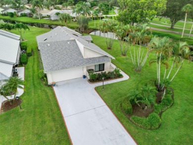 Enjoy peaceful lake views from this well-maintained 3-bedroom on Heritage Ridge Golf Club in Florida - for sale on GolfHomes.com, golf home, golf lot