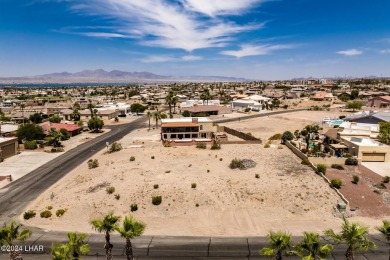 This remarkable corner lot boasts a captivating view of a on London Bridge Golf Course in Arizona - for sale on GolfHomes.com, golf home, golf lot