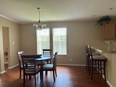 GORGEOUS OPEN AND SPLIT FLOOR PLAN HOME WITH TRAY CEILINGS AND on Silver Dollar Golf and Trap Club in Florida - for sale on GolfHomes.com, golf home, golf lot