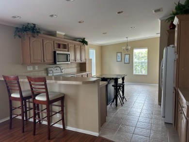 GORGEOUS OPEN AND SPLIT FLOOR PLAN HOME WITH TRAY CEILINGS AND on Silver Dollar Golf and Trap Club in Florida - for sale on GolfHomes.com, golf home, golf lot