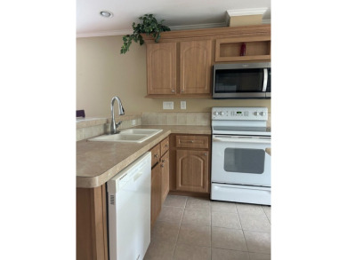 GORGEOUS OPEN AND SPLIT FLOOR PLAN HOME WITH TRAY CEILINGS AND on Silver Dollar Golf and Trap Club in Florida - for sale on GolfHomes.com, golf home, golf lot