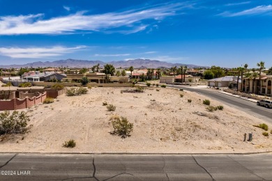 This remarkable corner lot boasts a captivating view of a on London Bridge Golf Course in Arizona - for sale on GolfHomes.com, golf home, golf lot