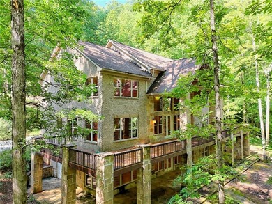Welcome to this magnificent custom mountain lodge home on 10.54 on Waterfall Country Club in Georgia - for sale on GolfHomes.com, golf home, golf lot