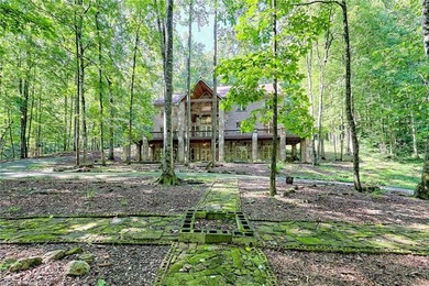 Welcome to this magnificent custom mountain lodge home on 10.54 on Waterfall Country Club in Georgia - for sale on GolfHomes.com, golf home, golf lot