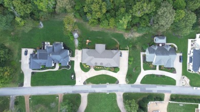 This residence is nestled on a secluded street with golf cart on Country Club of Paducah in Kentucky - for sale on GolfHomes.com, golf home, golf lot