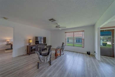 Welcome home to this light and airy 2 bedroom/2 bathroom corner on Mainlands Golf Club in Florida - for sale on GolfHomes.com, golf home, golf lot