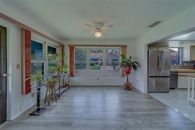 Welcome home to this light and airy 2 bedroom/2 bathroom corner on Mainlands Golf Club in Florida - for sale on GolfHomes.com, golf home, golf lot