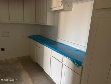 Waterfront - Boathouse - Two Boat Slips - Resort-Style Living on Lake Caroline Golf Club in Mississippi - for sale on GolfHomes.com, golf home, golf lot