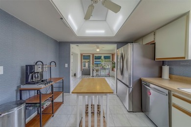 Welcome home to this light and airy 2 bedroom/2 bathroom corner on Mainlands Golf Club in Florida - for sale on GolfHomes.com, golf home, golf lot