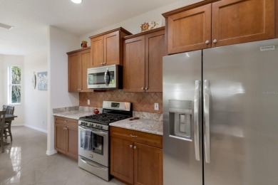 This meticulously maintained two-bedroom plus den, two-bathroom on University Park Country Club in Florida - for sale on GolfHomes.com, golf home, golf lot