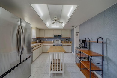 Welcome home to this light and airy 2 bedroom/2 bathroom corner on Mainlands Golf Club in Florida - for sale on GolfHomes.com, golf home, golf lot