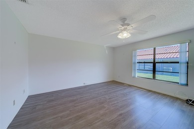 Welcome home to this light and airy 2 bedroom/2 bathroom corner on Mainlands Golf Club in Florida - for sale on GolfHomes.com, golf home, golf lot