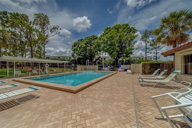 Welcome home to this light and airy 2 bedroom/2 bathroom corner on Mainlands Golf Club in Florida - for sale on GolfHomes.com, golf home, golf lot