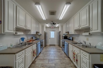 Welcome home to this light and airy 2 bedroom/2 bathroom corner on Mainlands Golf Club in Florida - for sale on GolfHomes.com, golf home, golf lot