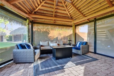 Turnkey RV Lot with Premium Tiki and Lake Views! Enjoy on Motorcoach Resort Golf Course in Florida - for sale on GolfHomes.com, golf home, golf lot