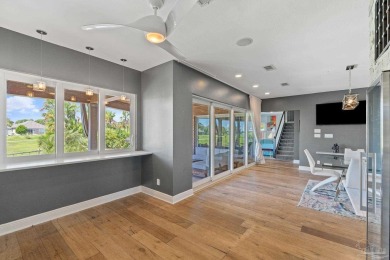 This modern sanctuary offering luxurious living nestled in Gulf on Tiger Point Golf and Country Club in Florida - for sale on GolfHomes.com, golf home, golf lot