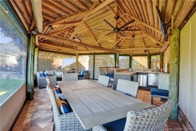 Turnkey RV Lot with Premium Tiki and Lake Views! Enjoy on Motorcoach Resort Golf Course in Florida - for sale on GolfHomes.com, golf home, golf lot