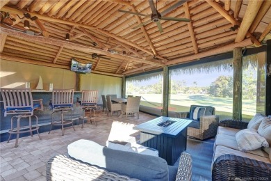 Turnkey RV Lot with Premium Tiki and Lake Views! Enjoy on Motorcoach Resort Golf Course in Florida - for sale on GolfHomes.com, golf home, golf lot