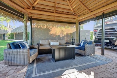 Turnkey RV Lot with Premium Tiki and Lake Views! Enjoy on Motorcoach Resort Golf Course in Florida - for sale on GolfHomes.com, golf home, golf lot