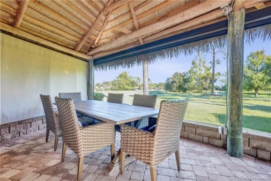 Turnkey RV Lot with Premium Tiki and Lake Views! Enjoy on Motorcoach Resort Golf Course in Florida - for sale on GolfHomes.com, golf home, golf lot