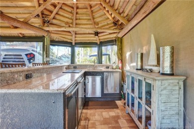 Turnkey RV Lot with Premium Tiki and Lake Views! Enjoy on Motorcoach Resort Golf Course in Florida - for sale on GolfHomes.com, golf home, golf lot