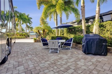 Turnkey RV Lot with Premium Tiki and Lake Views! Enjoy on Motorcoach Resort Golf Course in Florida - for sale on GolfHomes.com, golf home, golf lot