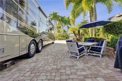 Turnkey RV Lot with Premium Tiki and Lake Views! Enjoy on Motorcoach Resort Golf Course in Florida - for sale on GolfHomes.com, golf home, golf lot